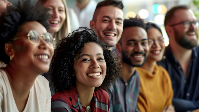 Group of happy coworkers at a training | How to Promote Mental Health Awareness in the Workplace Reduce Stigma and Offer Support