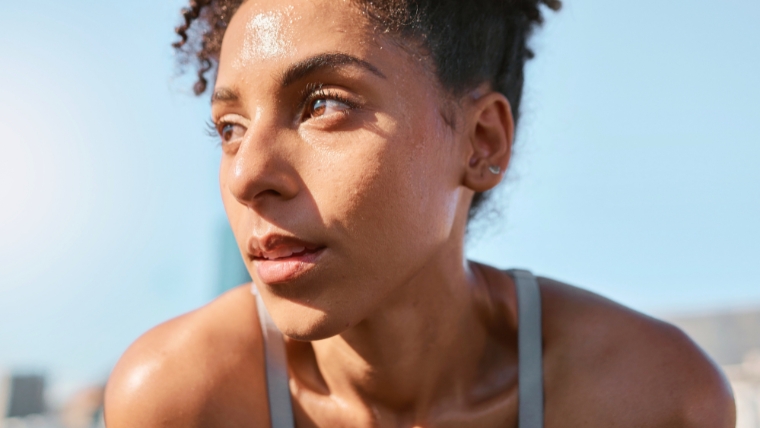 Athletic woman looking tired and sweaty in the middle of a workout | Does exercise REALLY improve your mental health The Truth Revealed | Mindful Health Solutions