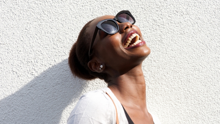 Woman laughing | Want Positive Mental Health The Powerful Role of Self-Esteem | Mindful Health Solutions