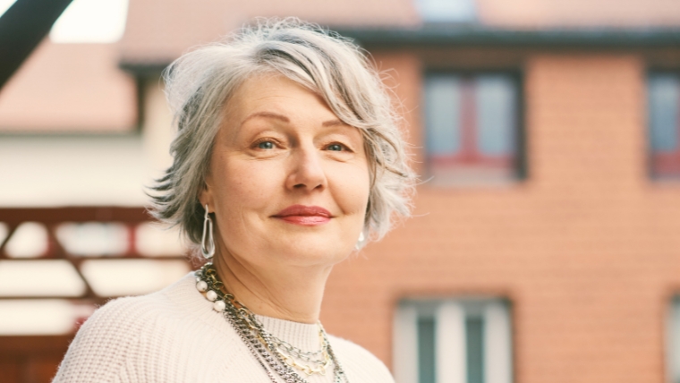 A woman in her 60s looking confident outside |Finding Relief for CRPS Explore the Promise of TMS Therapy | Mindful Health Solutions